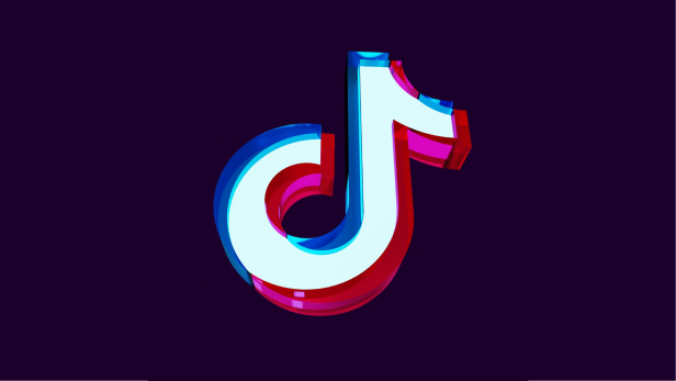 Weißes TikTok-Logo mit pink-blauer Umrandung auf dunklem Hintergrund