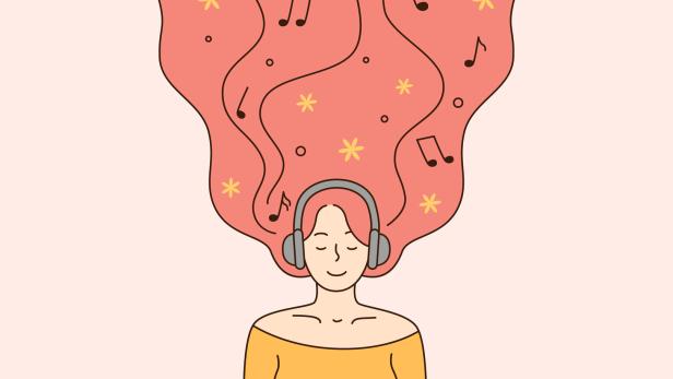 Frau mit langen Haaren und Kopfhörern hört Musik