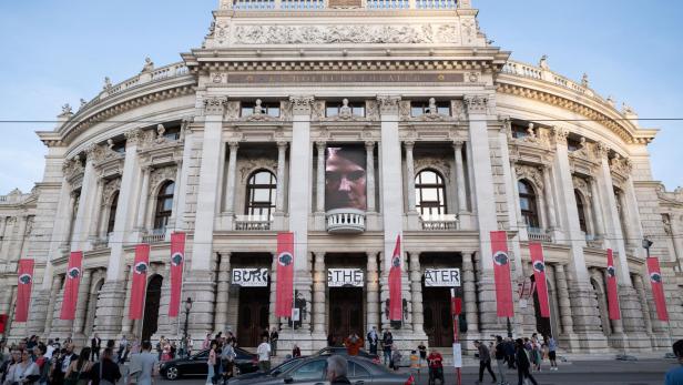 Austrian artist Flatz decorates Vienna's Burgtheater in Nazi-style flags featuring his dog Hitler, in Vienna