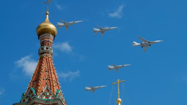FILE PHOTO: Russian army Tupolev Tu-160 and Tupolev Tu-22M3 fly in formation over St. Basil's Cathedral during the rehearsal for the Victory Day parade in Moscow