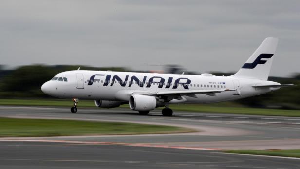 FILE PHOTO: A Finnair Airbus A320 aircraft prepares to take off from Manchester Airport in Manchester