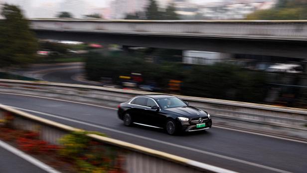 FILE PHOTO: Electric vehicle (EV) by Mercedes-Benz moves on a street in Beijing