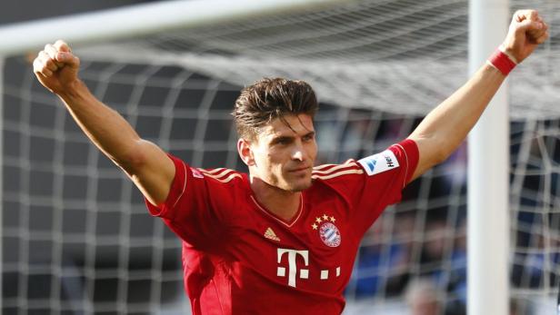 Mario Gomez of Bayern Munich celebrates a goal against TSG Hoffenheim during their German first division Bundesliga soccer match in Sinsheim, March 3, 2013. REUTERS/Kai Pfaffenbach (GERMANY - Tags: SPORT SOCCER) DFL RULES TO LIMIT THE ONLINE USAGE DURING MATCH TIME TO 15 PICTURES PER GAME. IMAGE SEQUENCES TO SIMULATE VIDEO IS NOT ALLOWED AT ANY TIME. FOR FURTHER QUERIES PLEASE CONTACT DFL DIRECTLY AT + 49 69 650050