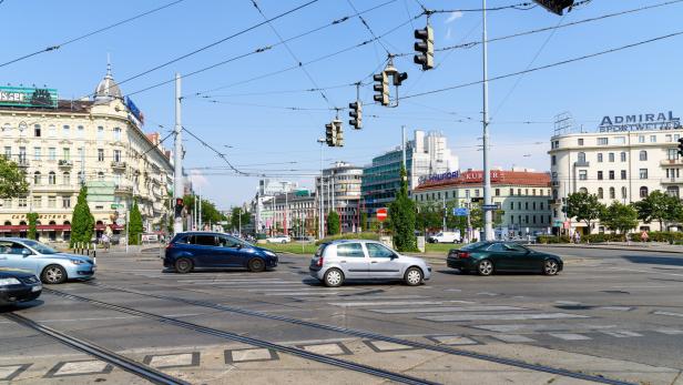 Busy Traffic And People On Downtown Streets Of Vienna City