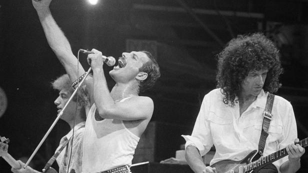 Freddie Mercury and Brian May of the band Queen perform at Live Aid
