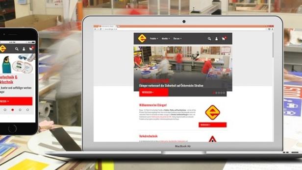 Ein Laptop und ein Smartphone zeigen die Webseite von Ebinger Werbetechnik.