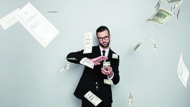 Spectacles jackpot entrepreneur economist banker chic posh manager jacket concept. Handsome confident cunning clever wealthy rich luxury guy holding wasting stack of money isolated on gray background
