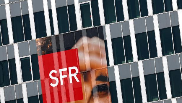 The logo of French telecoms operator SFR is seen on an advertising board in Paris