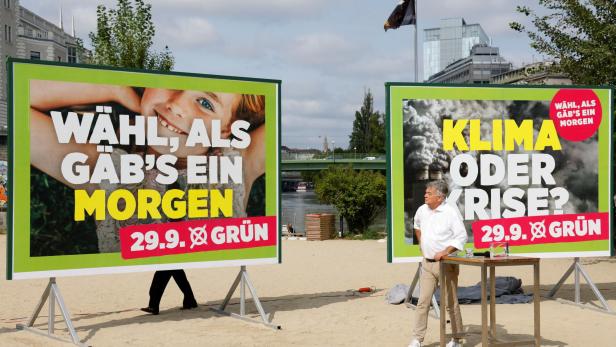 Austrian Vice Chancellor and head of Green Party Werner Kogler presents election campaign posters in Vienna