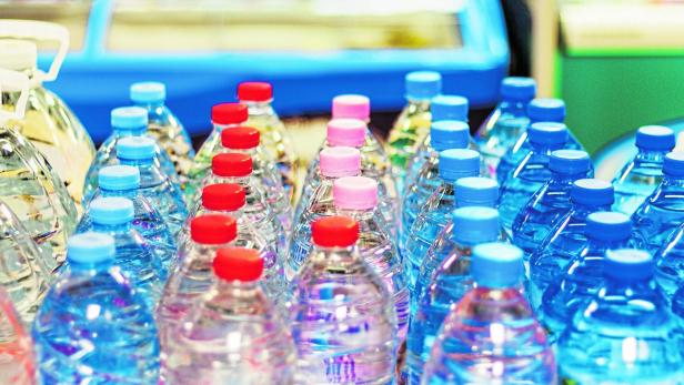 colorful caps on plastic bottles with water