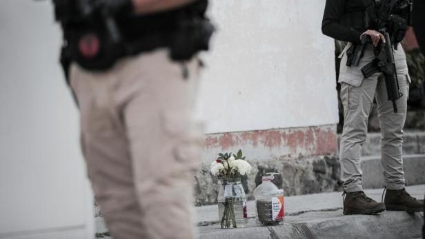 Police officers guard the scene where mayoral candidate Armando Perez Luna was killed, in Maravatio