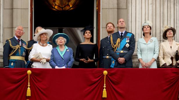 FILE PHOTO: Britain's Queen Elizabeth is joined by members of the Royal Family on the balcony of Buckingham Palace as they watch a fly past to mark the centenary of the Royal Air Force in central London