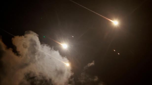 FILE PHOTO: Projectiles are seen in the sky after Iran fired a salvo of ballistic missiles, amid cross-border hostilities between Hezbollah and Israel, as seen from Tel Aviv