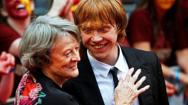 FILE PHOTO: Maggie Smith and Rupert Grint share a light moment on the red carpet as they arrive for the world premiere of "Harry Potter and the Half Blood Prince" at Leicester Square in London