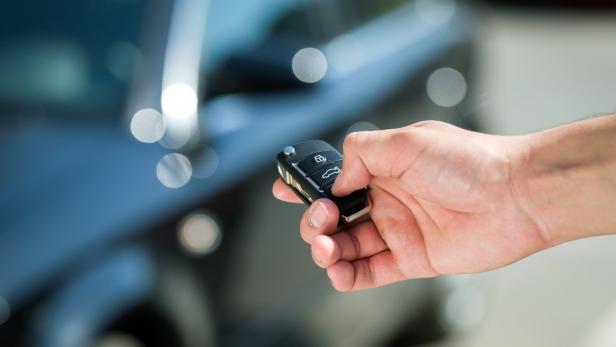 man hand unlocking car