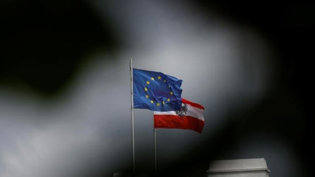 An Austrian and European Union flag flutter in Vienna