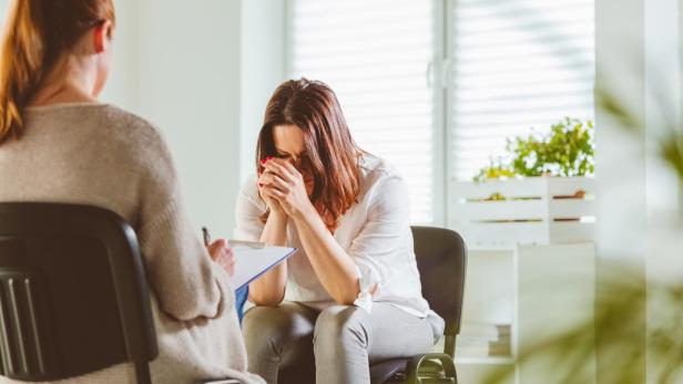 Depressed female with psychotherapist