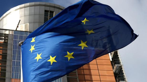 FILE PHOTO: A European Union flag flutters outside the EU Commission headquarters in Brussels