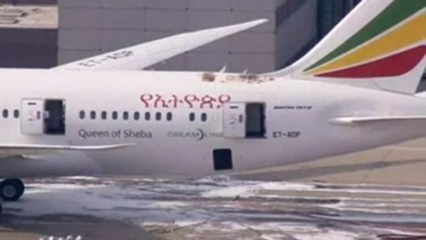 A view of the tail section of a Boeing 787 Dreamliner, operated by Ethiopian Airlines, which caught fire at Britain&#039;s Heathrow airport is seen in this July 12, 2013 still image taken from video. The plane caught fire at the airport on Friday, forcing the closure of both runways. Television footage showed the Dreamliner surrounded by foam used by firefighters. Heathrow briefly closed both its runways to deal with the fire which broke out while the plane was parked at a remote stand. There were no passengers aboard the plane. REUTERS/Pool via Reuters TV (BRITAIN - Tags: TRANSPORT DISASTER) ATTENTION EDITORS - NO ACCESS UK/DAYBREAK. NO SALES. NO ARCHIVES. FOR EDITORIAL USE ONLY. NOT FOR SALE FOR MARKETING OR ADVERTISING CAMPAIGNS. UNITED KINGDOM OUT. NO COMMERCIAL OR EDITORIAL SALES IN UNITED KINGDOM