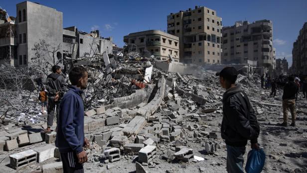 Palestinians inspect the rubble after renewed Israeli airstrikes on Gaza Palestinians inspect the rubble after renewed Israeli airstrikes on Gaza