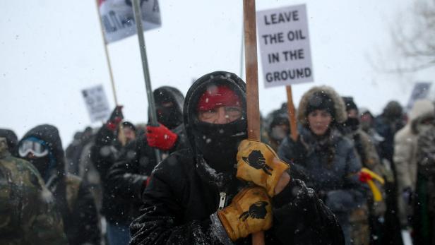 FILE PHOTO: A Native American man leads a protest march near Standing Rock Indian Reservation, North Dakota FILE PHOTO: A Native American man leads a protest march near Standing Rock Indian Reservation, North Dakota