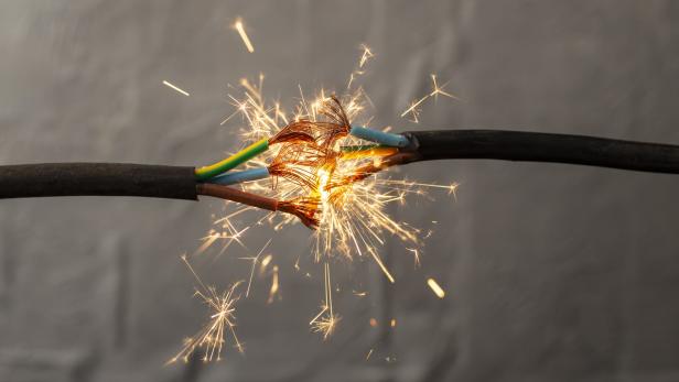 sparks explosion between electrical cables, fire hazard concept