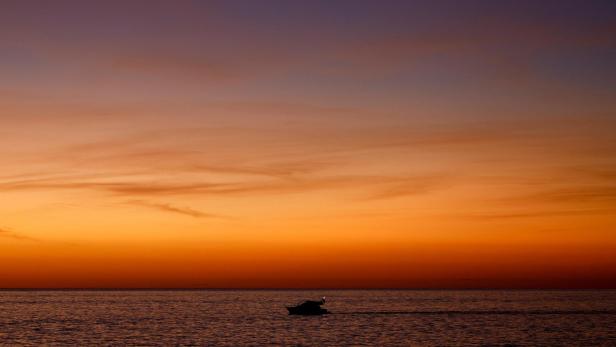 The sun sets in Arguineguin south of the island of Gran Canaria