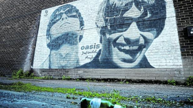 FILE PHOTO: A view of a mural of Oasis band members Liam and Noel Gallagher by artist Pic.One.Art on the side of Sifters record shop in the Burnage area of Manchester