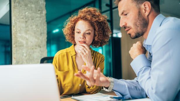 Two business people working together in office