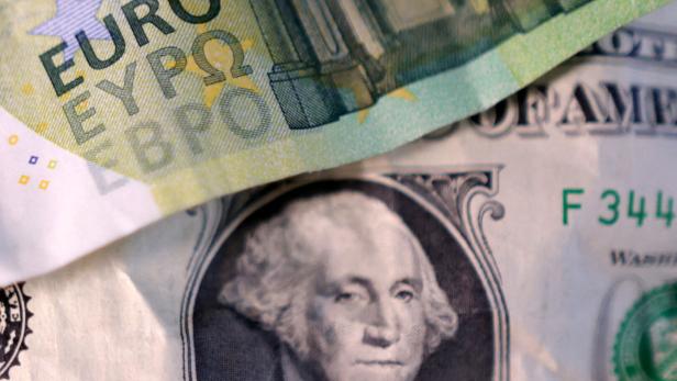 FILE PHOTO: Illustration shows U.S. dollar and Euro banknotes FILE PHOTO: Illustration shows U.S. dollar and Euro banknotes