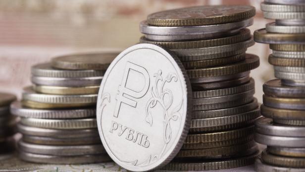 coin ruble on the background of banknotes and money stacks coin ruble on the background of banknotes and money stacks