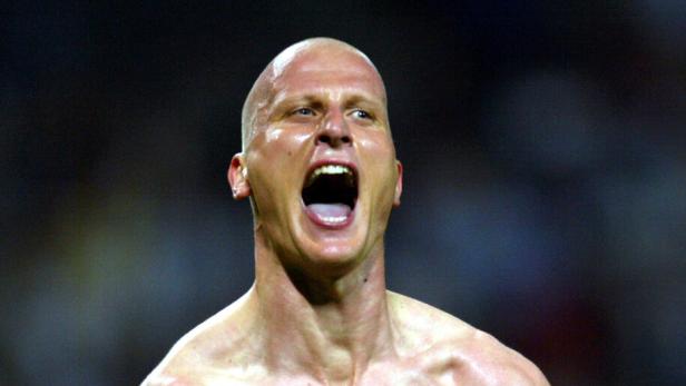 Germany's Carsten Jancker celebrates scoring the fourth goal during their group E match against [Sau..
