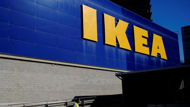 FILE PHOTO: FILE PHOTO: FILE PHOTO: Worker walks past a logo of IKEA on the facade of an IKEA store in Barcelona