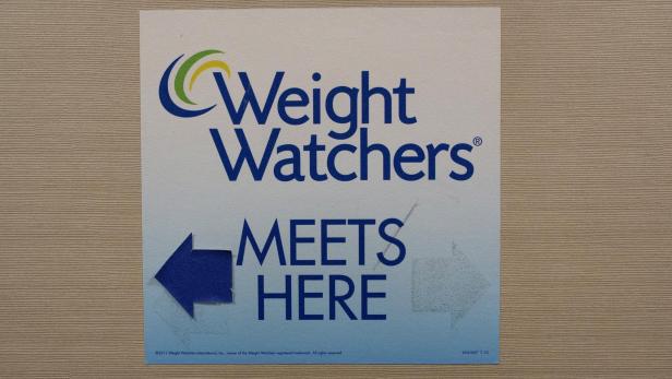 FILE PHOTO: Sign for Weight Watchers is displayed at an office in New York