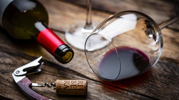Spanish Ribera del Duero red wine cork stopper, wineglass and wine bottle on rustic wooden table