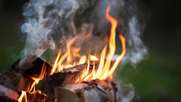 Burning campfire, flames and smoke