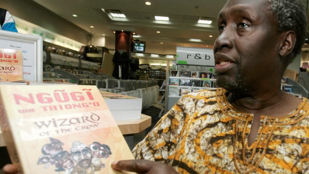 FILE PHOTO: Kenyan author Ngugi Wa Thiong'o shows his newly launched book "Wizard of the Crow" at a bookshop in downtown Nairobi FILE PHOTO: Kenyan author Ngugi Wa Thiong'o shows his newly launched book "Wizard of the Crow" at a bookshop in downtown Nairobi