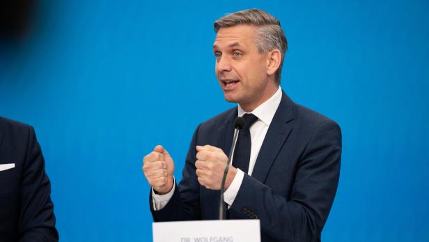 Austrian Economics Minister Wolfgang Hattmannsdorfer attends a press conference in Vienna