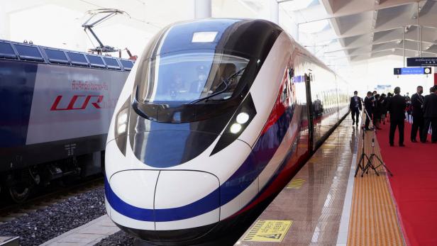 FILE PHOTO: A train is ready on the station during the handover ceremony of the high-speed rail project linking the Chinese southwestern city of Kunming with Vientiane in Laos