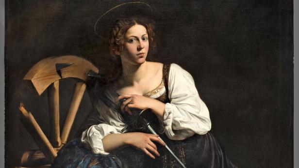 Eine Frau mit Heiligenschein hält ein Schwert, neben ihr ein Rad.