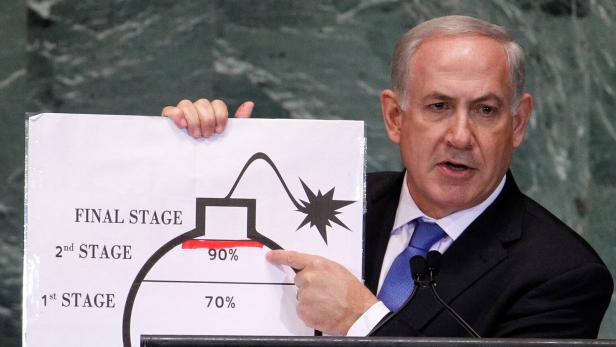 FILE PHOTO: Israel's Prime Minister Netanyahu points to red line he drew on graphic of bomb used to represent Iran's nuclear program, in New York