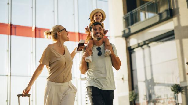 Excited Family Going on Vacation Together