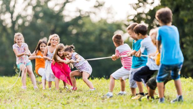 Children pulling a rope.