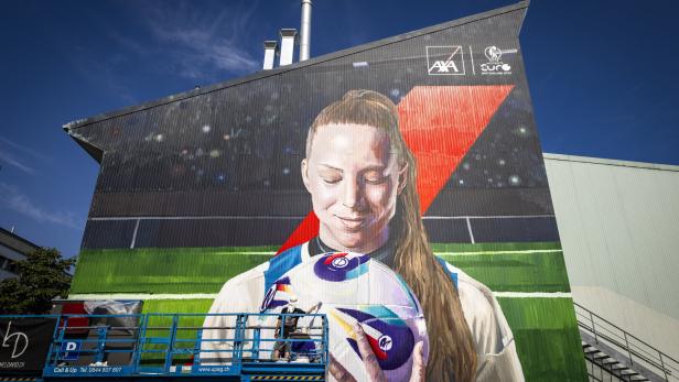 Visual artist Lionel David paints mural next to Letzigrund stadium in Zuerich