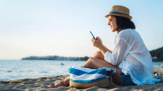 Using phone at the beach