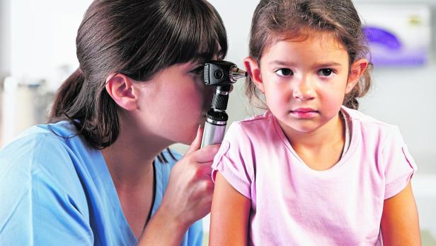 Doctor Examining Child's Ears