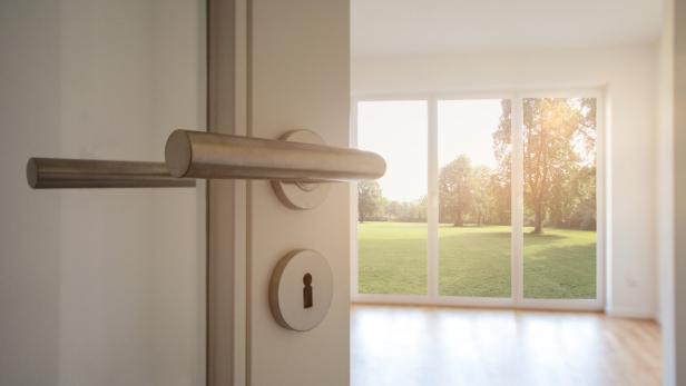 Relocation, Moving to new apartment - Door to modern living room with view to garden