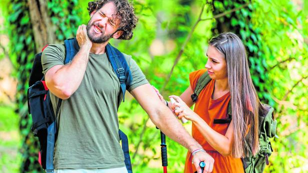 Man and his Wife are Scratching Itchy Skin due to the Attack of Insects in Nature.