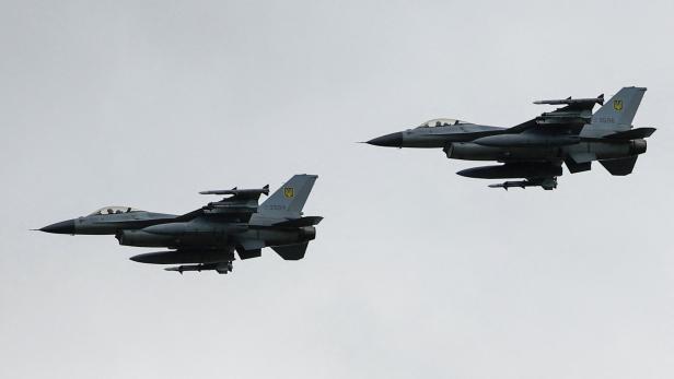 Ukrainian F-16 fighting aircrafts are seen in the air during marking the Day of the Ukrainian Air Forces in an undisclosed location in Ukraine
