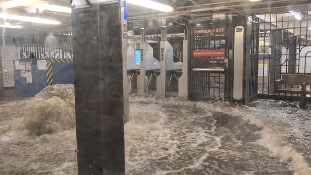 A view shows a flooded subway station in New York